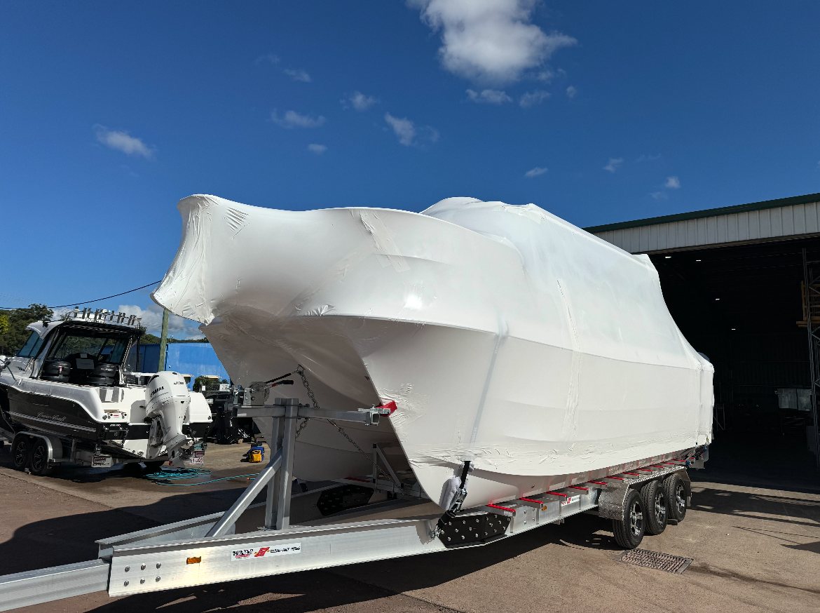 Wrapped boat on a triple-axle trailer